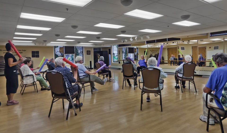 women exercising in chairs