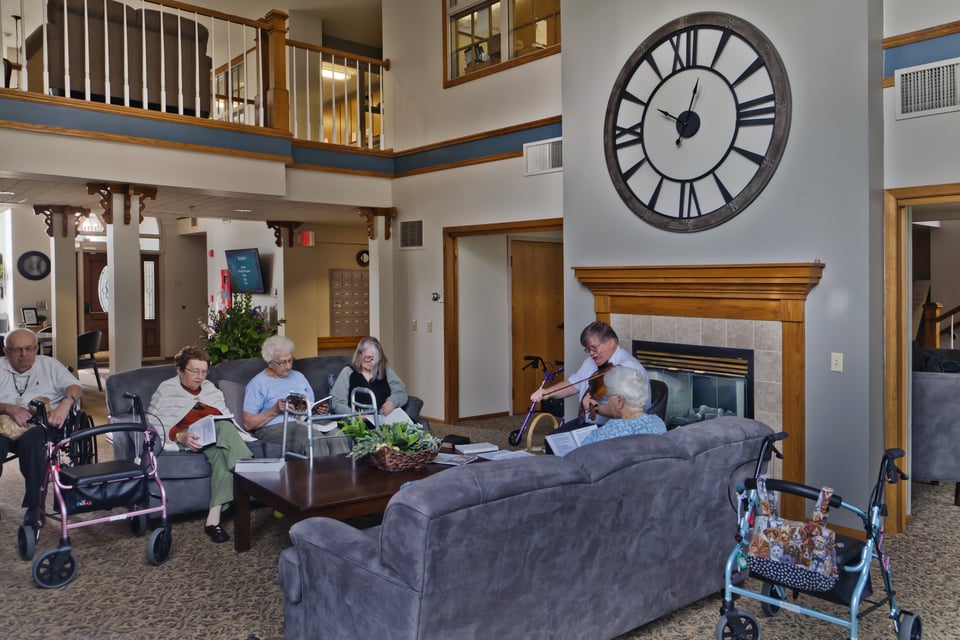 residents in lobby listening to music