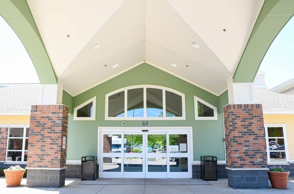 outdoor community with green walls and brick pillars