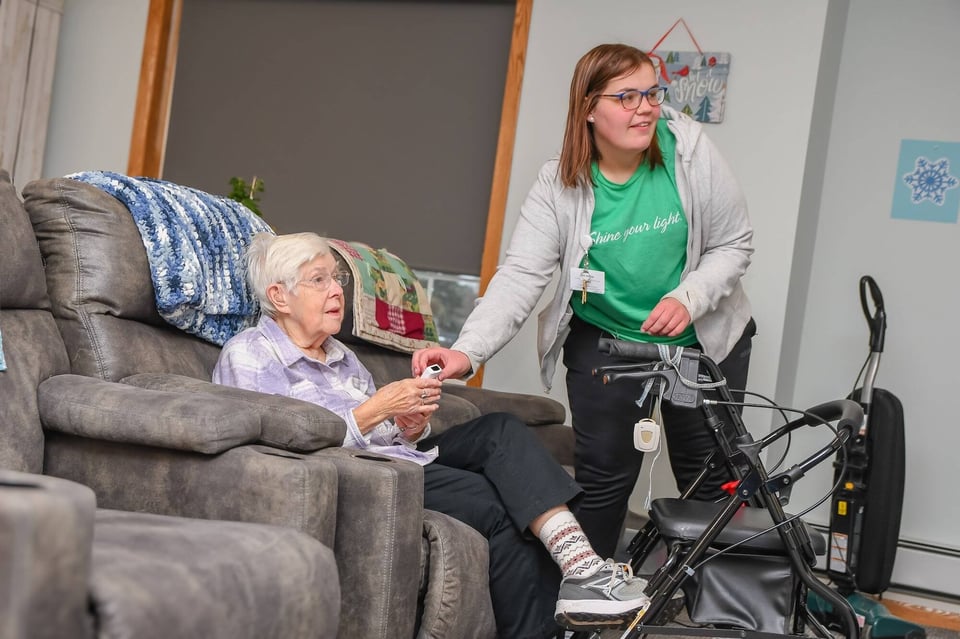 nurse helping woman play game
