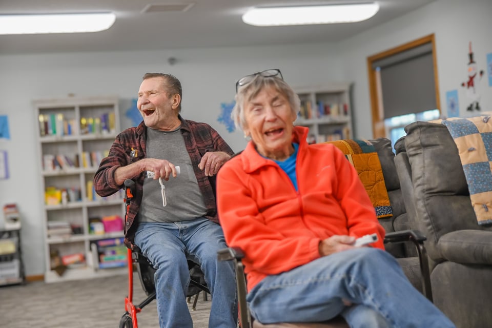 smiling man and woman playing game