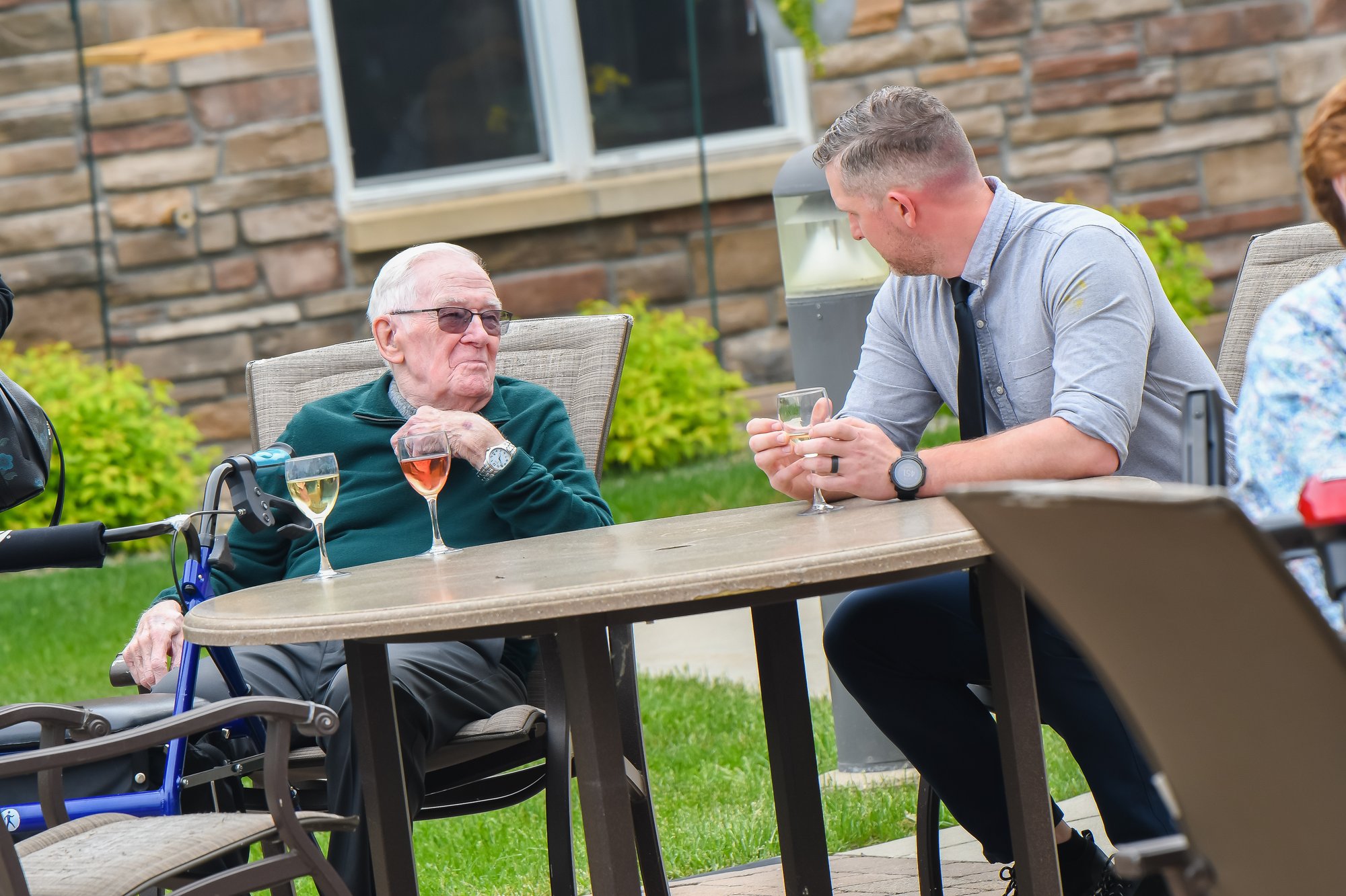 men with beverages on patio