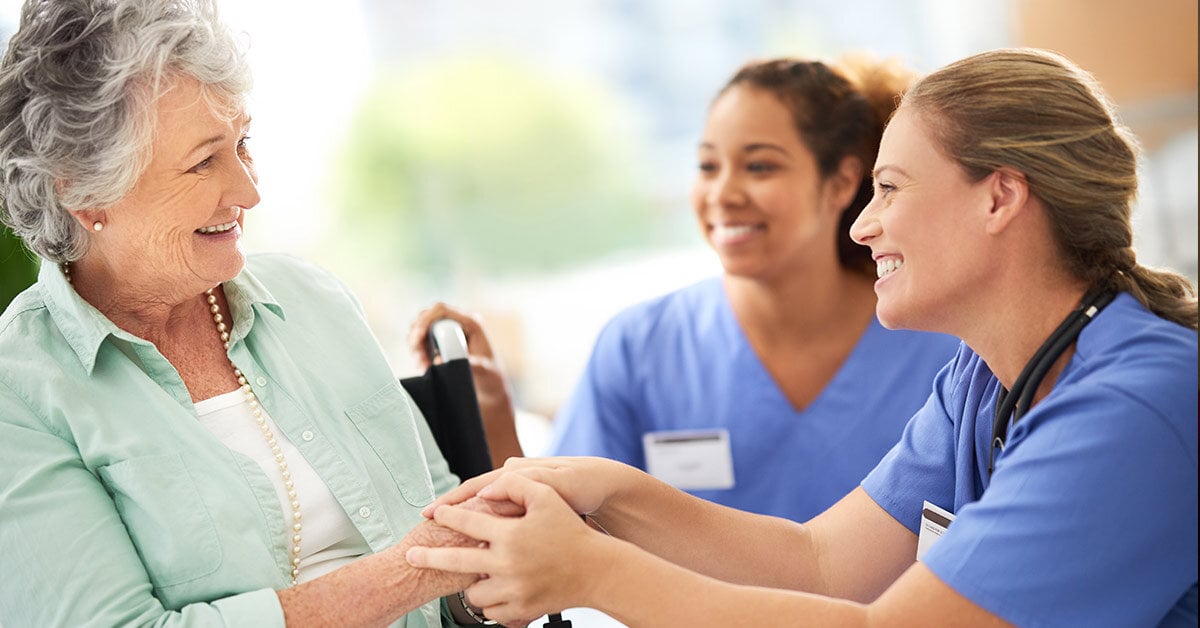 Senior woman with nurses