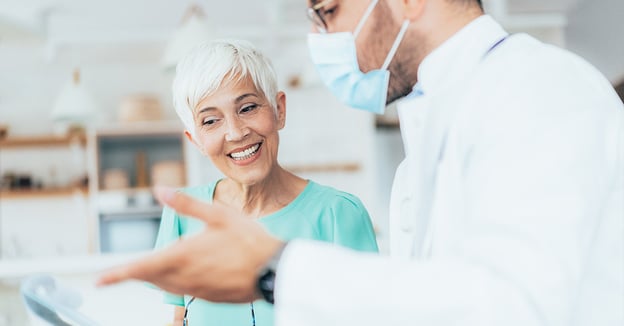 Senior talking with dentist