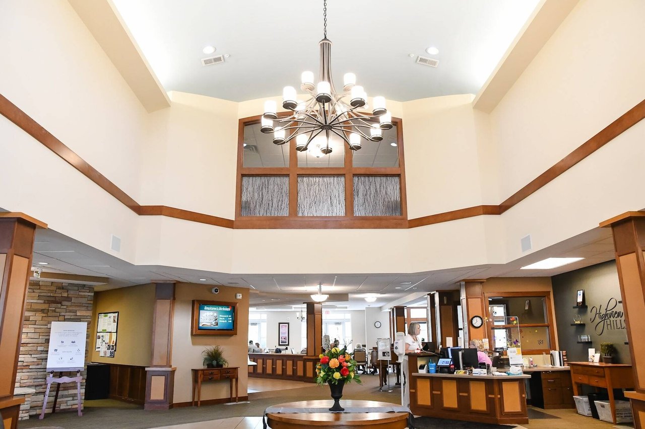 lobby with high bright ceiling and chandelier