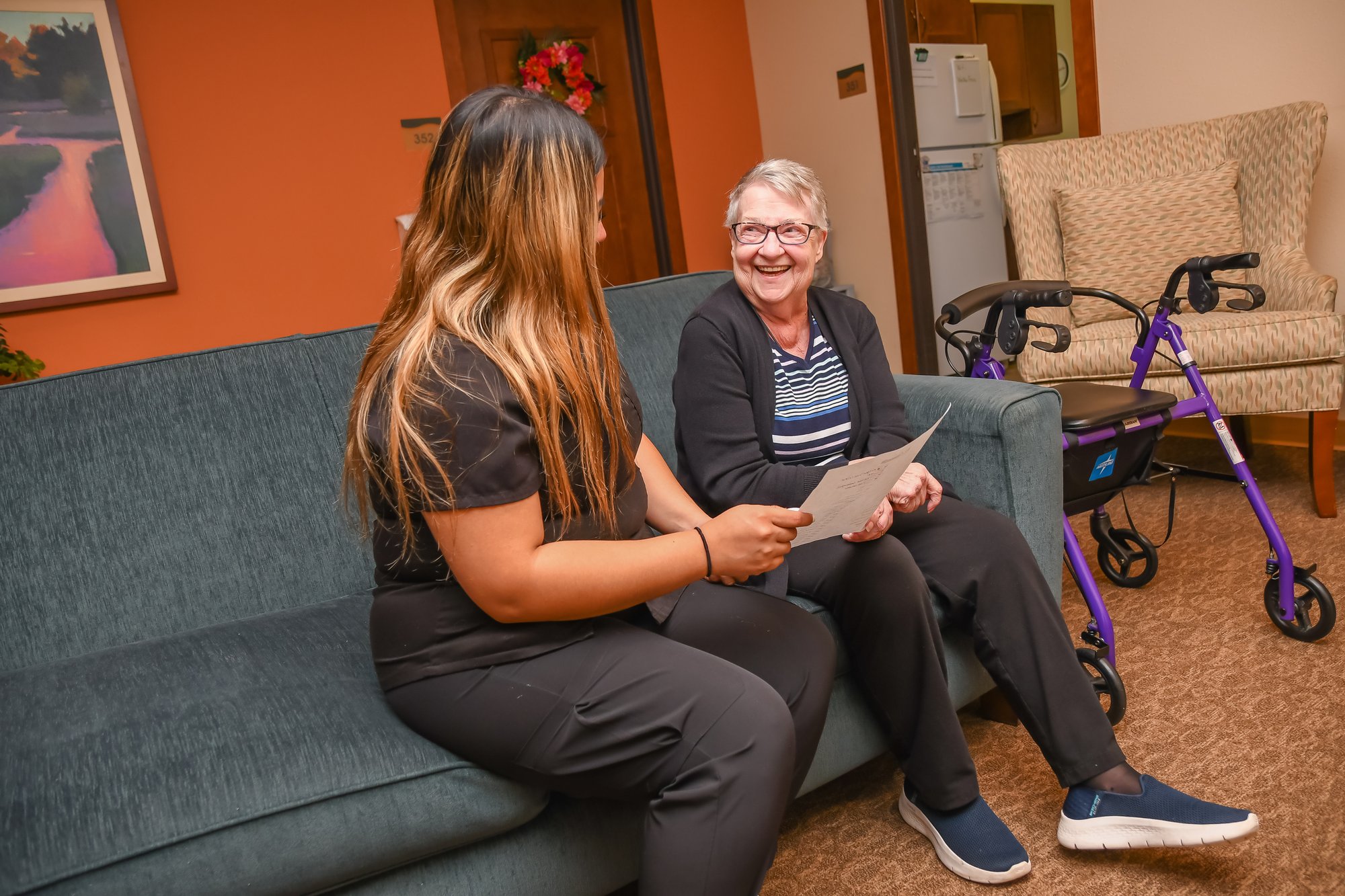nurse on couch with woman