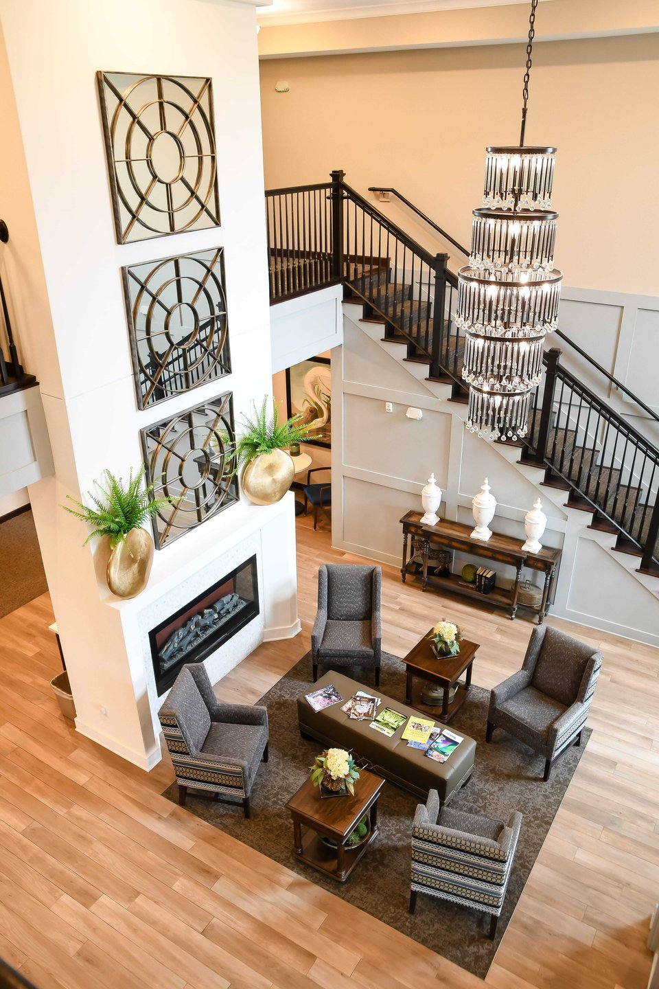 lobby with fireplace and staircase