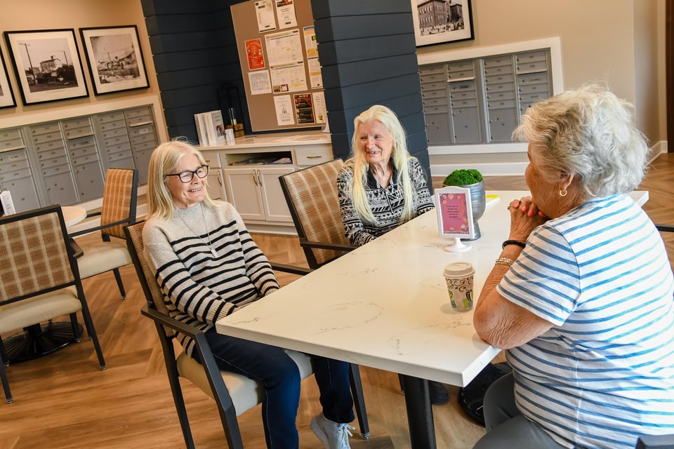 women sitting around lobby table