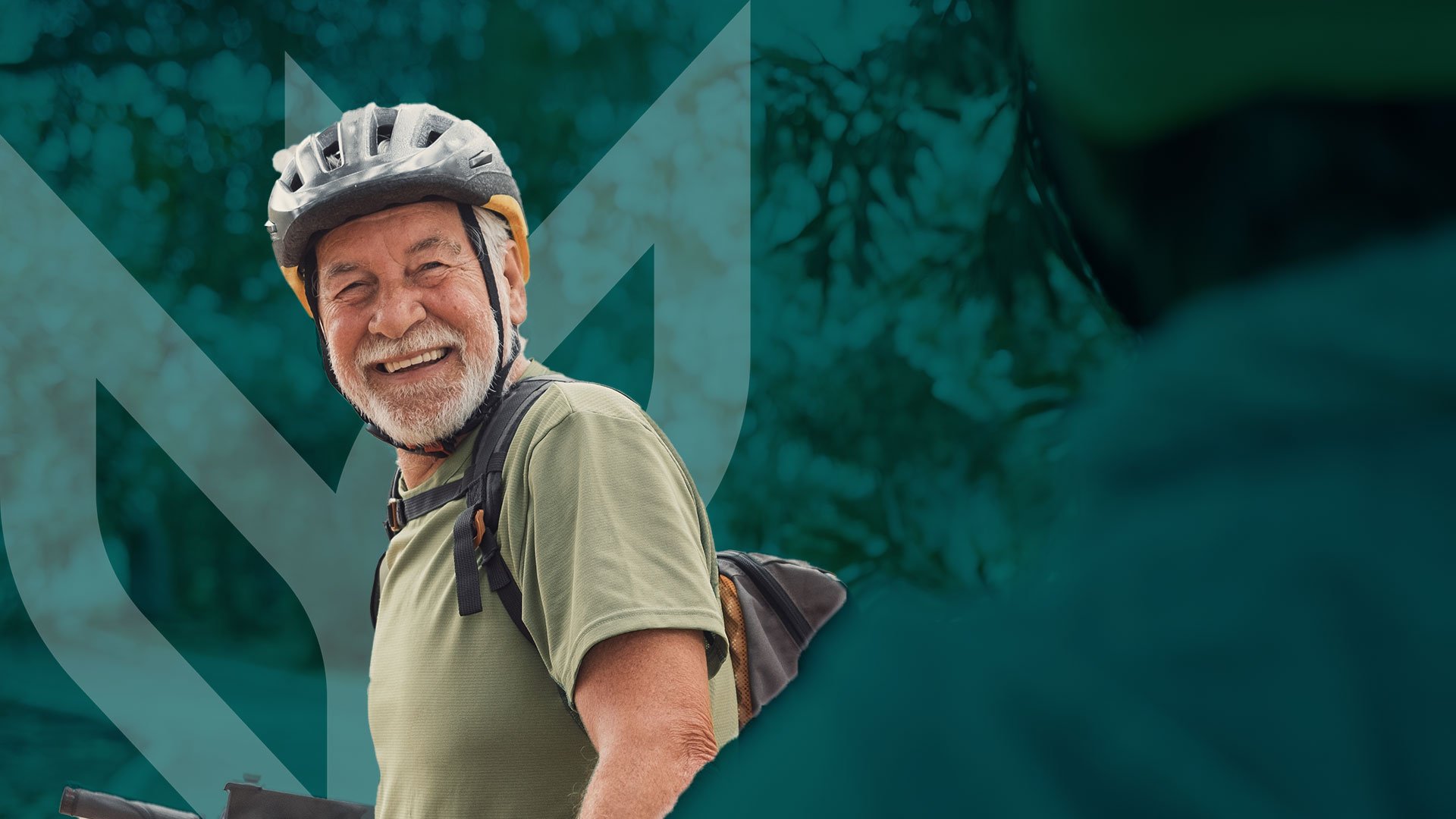 Photo of an older man wearing bicycle helmet to stay fit