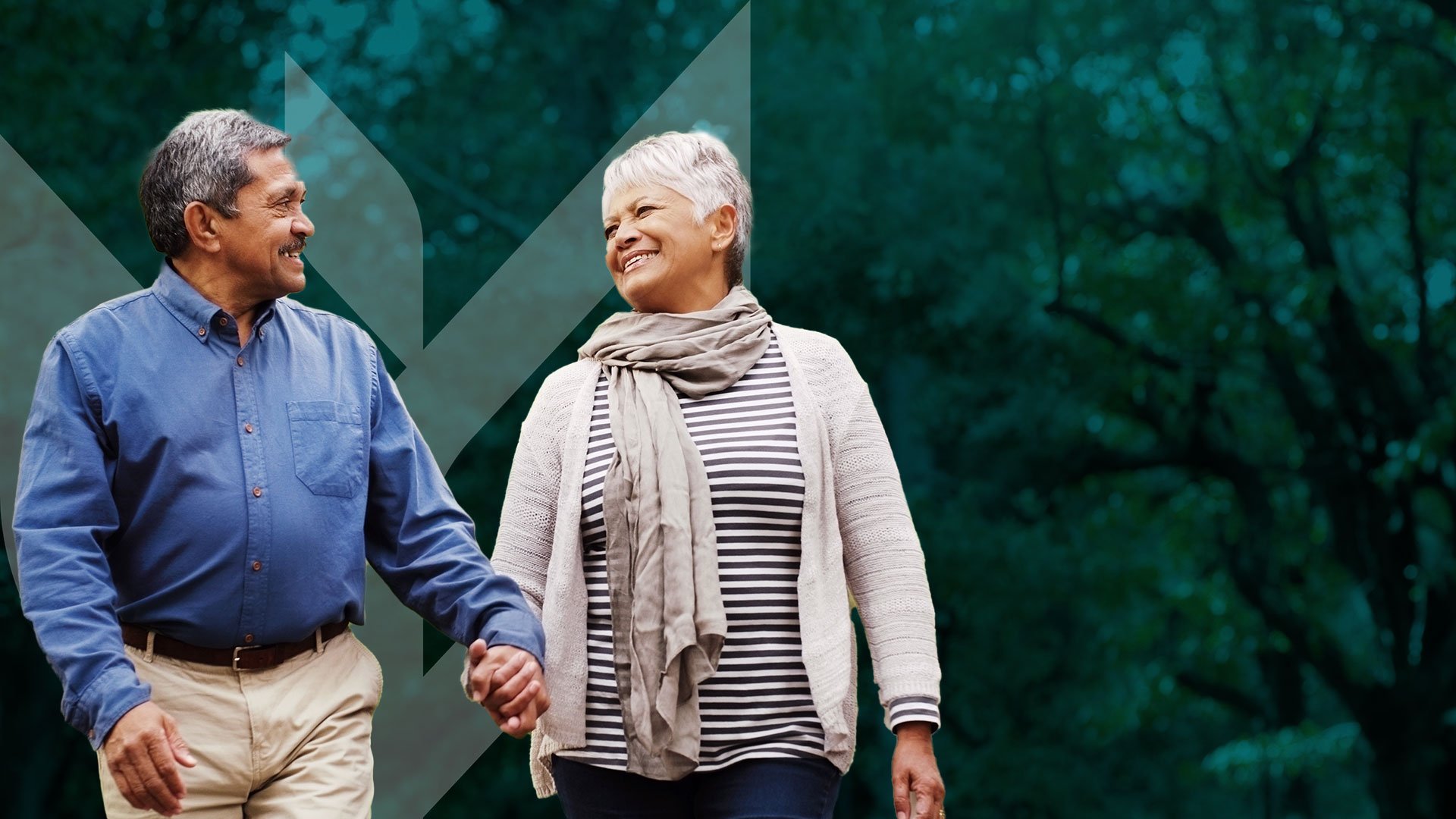 Photo of a man and woman holding hands smiling