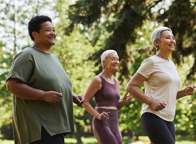 Photo of older women jogging outdoors