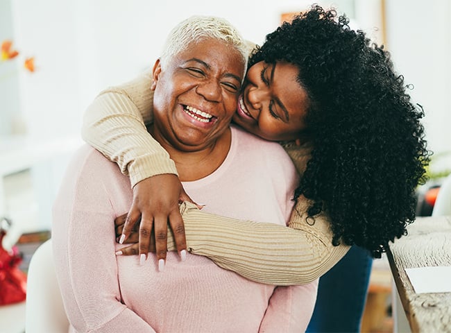 Photo of a woman and her daughter hugging