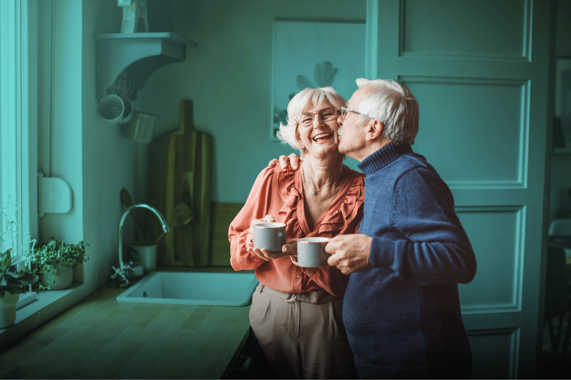 man kissing smiling woman