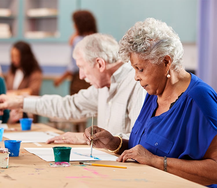 man and woman painting